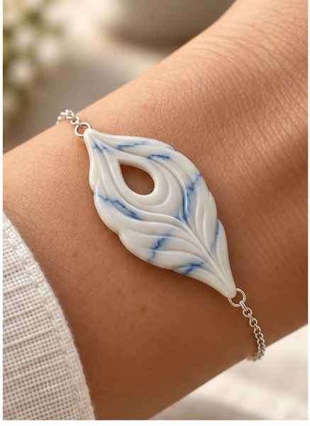 White and blue carved peacock-feather bracelet concept