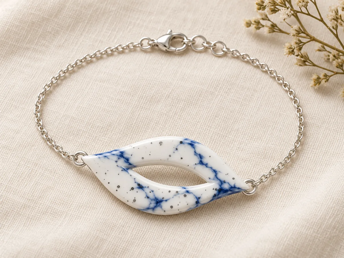 White leaf bracelet with blue veins and dark speckles